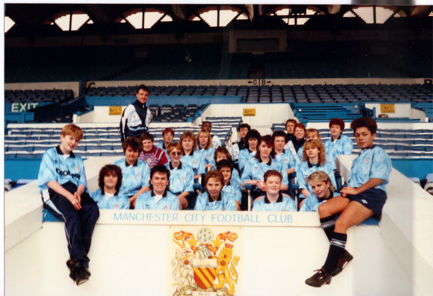 The Manchester City Ladies squad in 1989 sat in the Directors' Box at Maine Road
